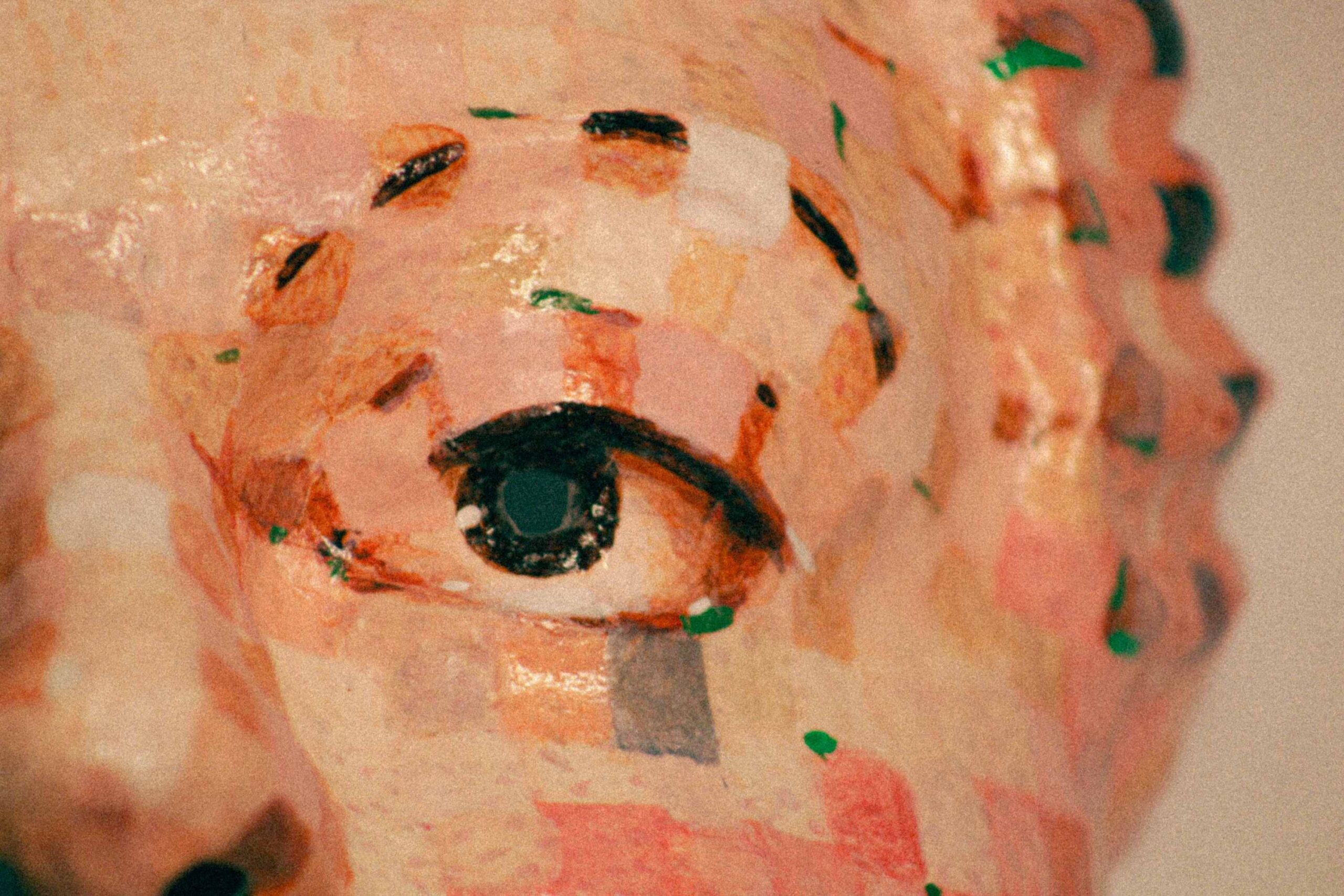 extreme close-up of a single eye on the mask, emphasizing brushwork, color blocks, and reflective highlights